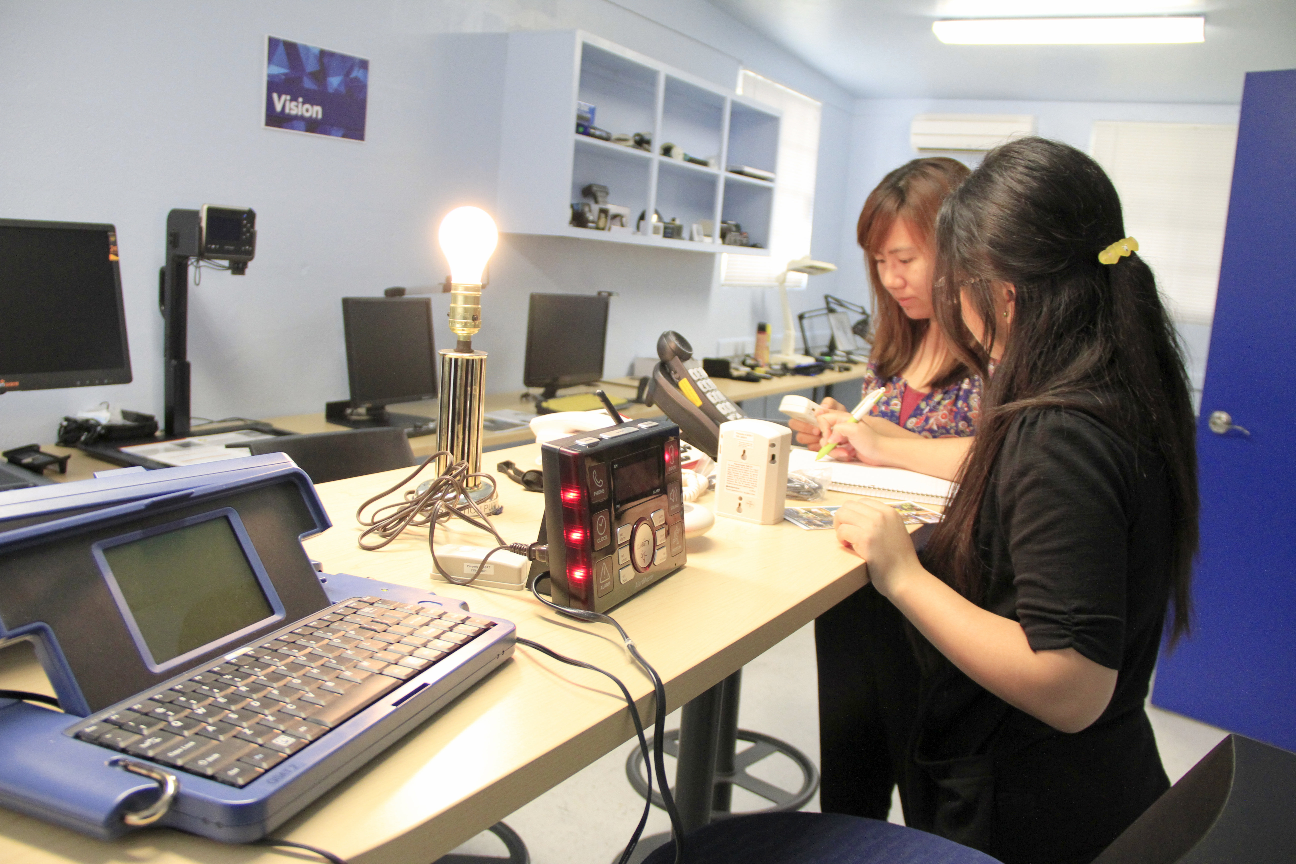On February 11, 2016, Tourism Majors, Elizabeth Molina (Left), and Daisy Mañalac  list various Assistive Technology that can help eliminate barriers for a Hotel General Manger who is Deaf/Hard of Hearing.  This was a class requirement for Dr. Richard Colfax’s class in BA241- Human Resources Management Class.