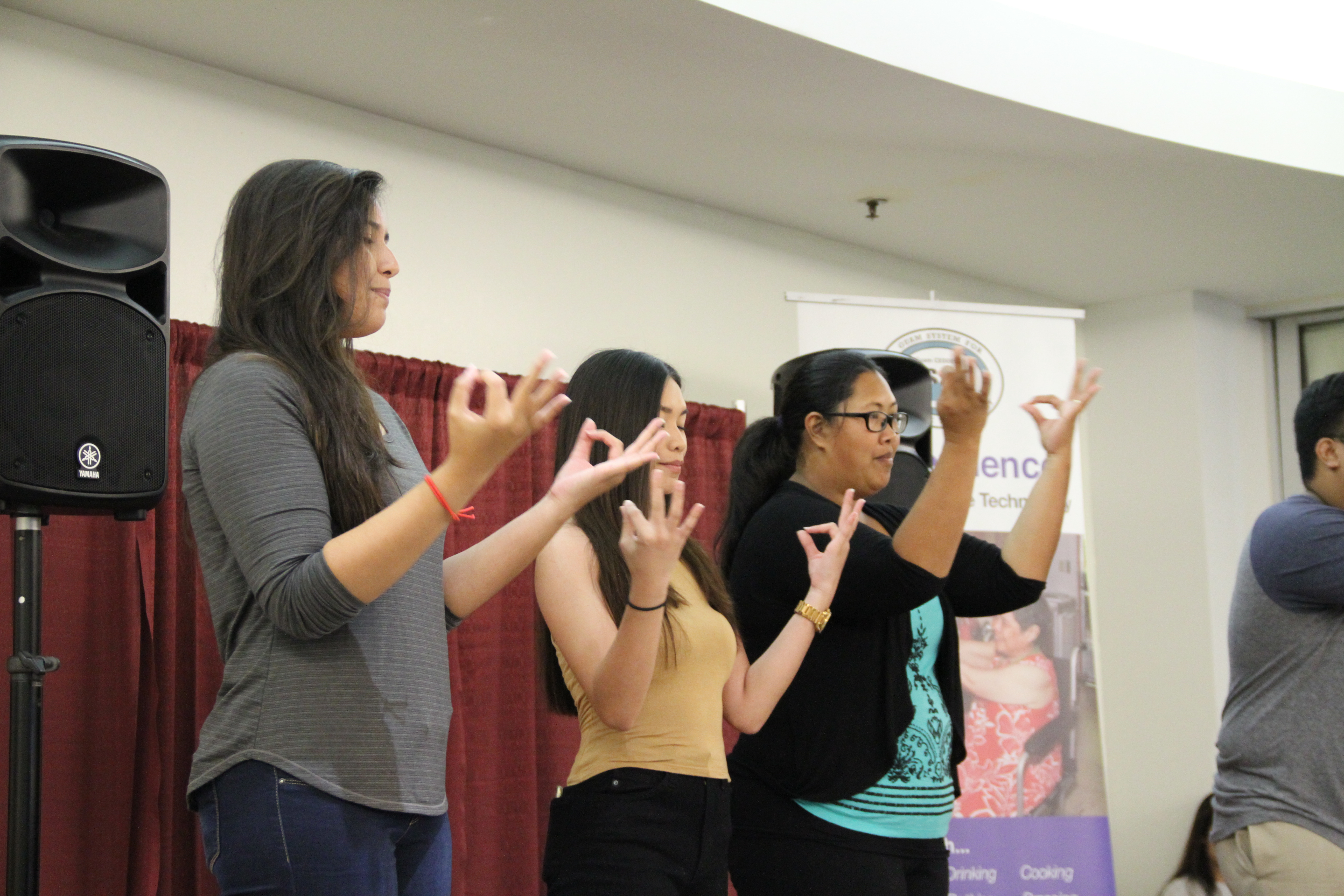 Students from the American Sign Language classes at Guam Community College provided entertainment at the GSAT AT Fair with signed songs and stories.