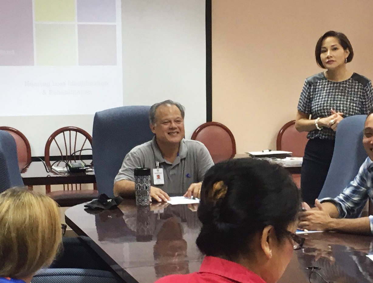 Ten pediatricians attended a presentation on "Hearing Loss and Rehabilitation" conducted by Renee L.G. Koffend, AuD., Guam EHDI consultant (standing), on May 12 at the Guam Memorial Hospital Authority Board Room.  The presentation was facilitated by Robert Leon Guerrero, M.D. (seated at the head of the table) Guam EHDI Pediatric Champion since the establishment of the project in 2002.   