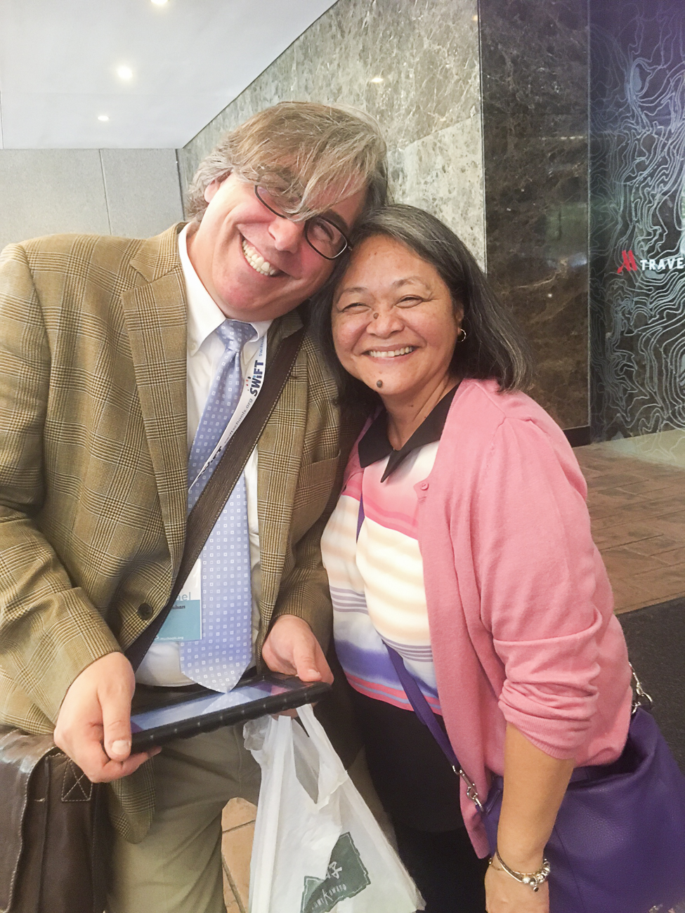 June De Leon, Guam CEDDERS Associate Director, shares a laugh with collaborator and friend, Michael McSheehan, SWIFT TA Facilitator, University of New Hampshire, while at the “Better Together” SWIFT Professional Learning Institute, July 21 & 22.