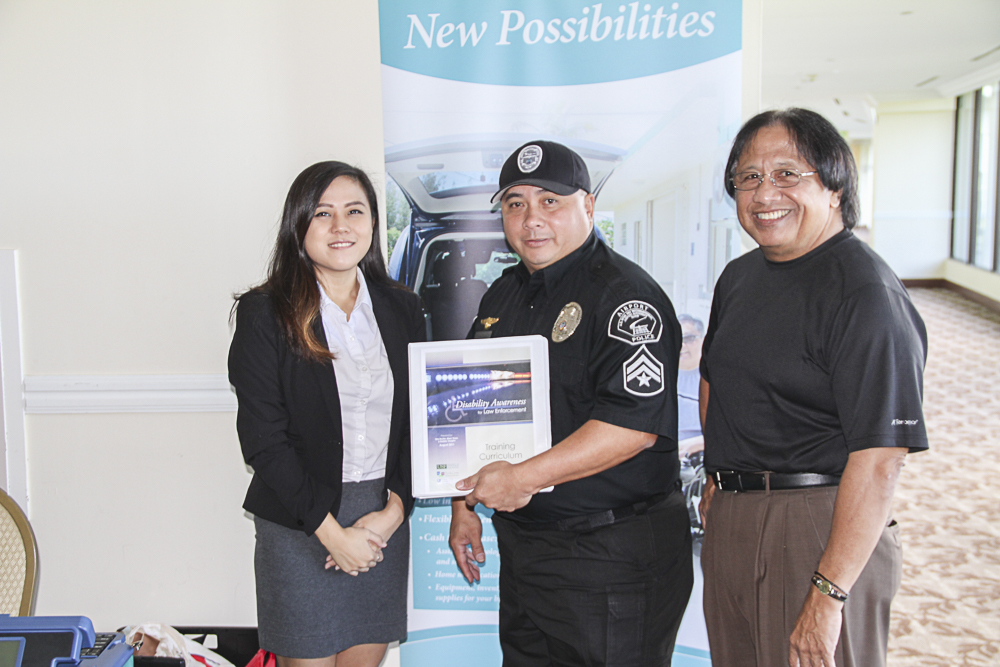 Guam CEDDERS provided a copy of the University of South Florida’s “Training Curriculum: Disability Awareness for Law Enforcement” during the National Disability Employment Awareness Month (NDEAM) Conference held at the Hotel Nikko Guam on Friday, October 21, 2016. Shown above are (L-R): Christina Jung, CEDDERS Research Associate; Kenneth Quenga, Airport Police Officer; and Pete Camacho, and Coordinator.