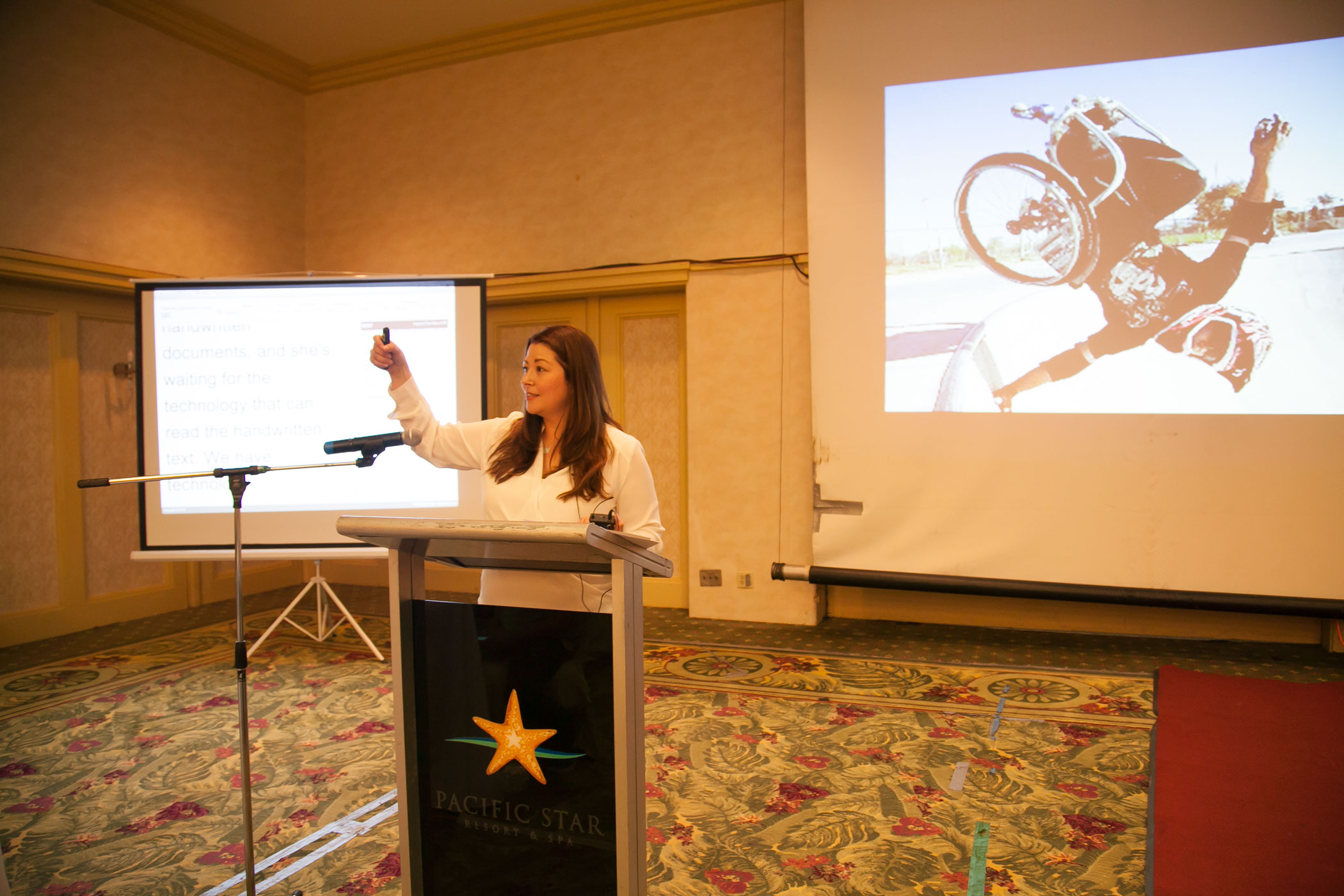Photo of Carla Torres, Assistive Technology and Special Projects Program Coordinator, conducting a presentation.